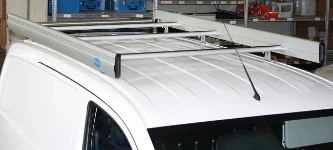 Porte-bagages avec barres de rétention latérales et rouleau pour Nissan NV200